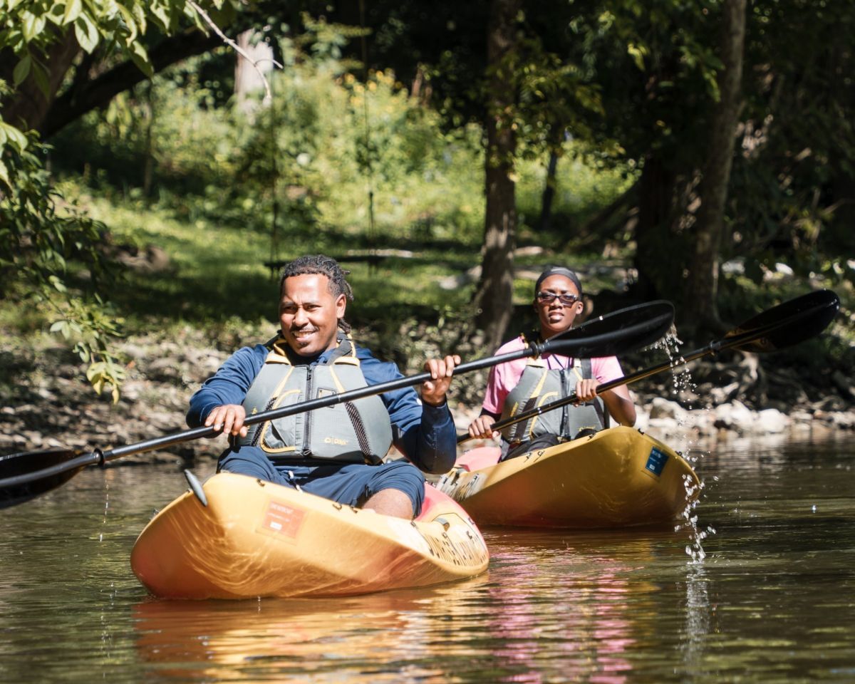 Two kayakers paddling